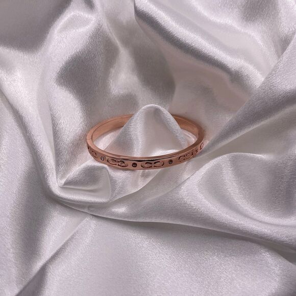 COACH Women's Rose Gold Kissing C Logo Signature Hinged Crystal Bangle Bracelet - Picture 2 of 12